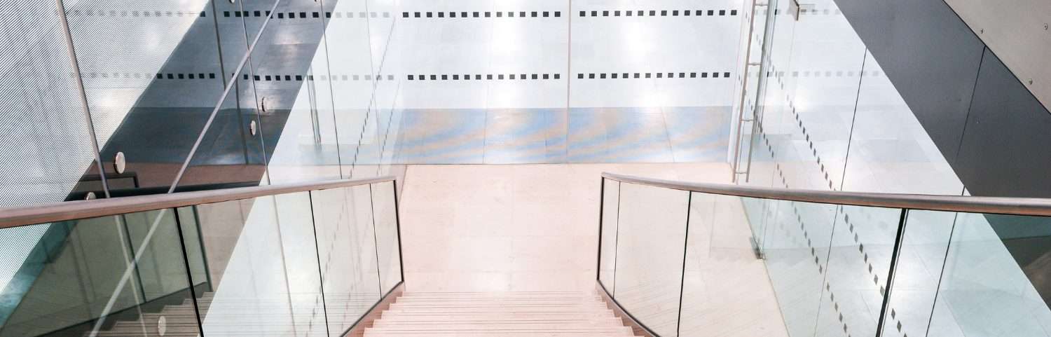 Staircase with glass balustrades in a modern interior